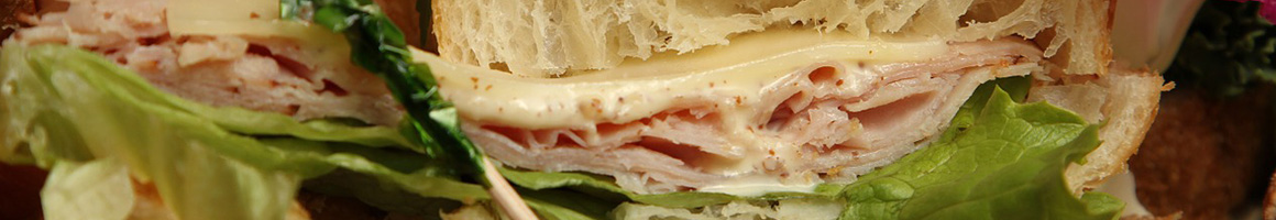 Eating Deli Italian Pizza Sandwich at All American Sandwiches N Pizza restaurant in San Diego, CA.